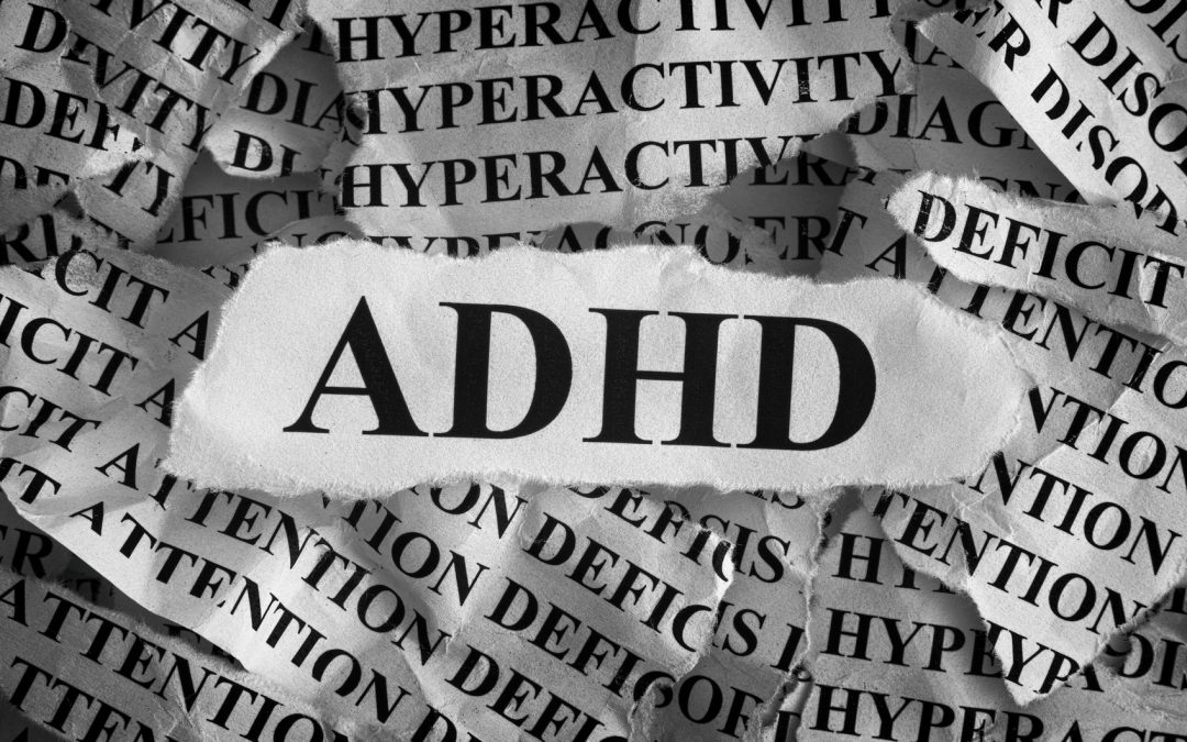 Torn pieces of paper with abbreviation ADHD